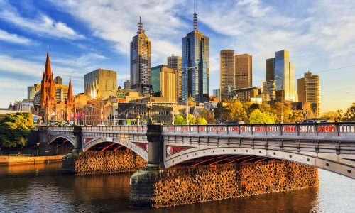 Me Princes Br Morning light Warm morning light on high-rise towers in Melbourne CBD above Princes bridge across Yarra river.